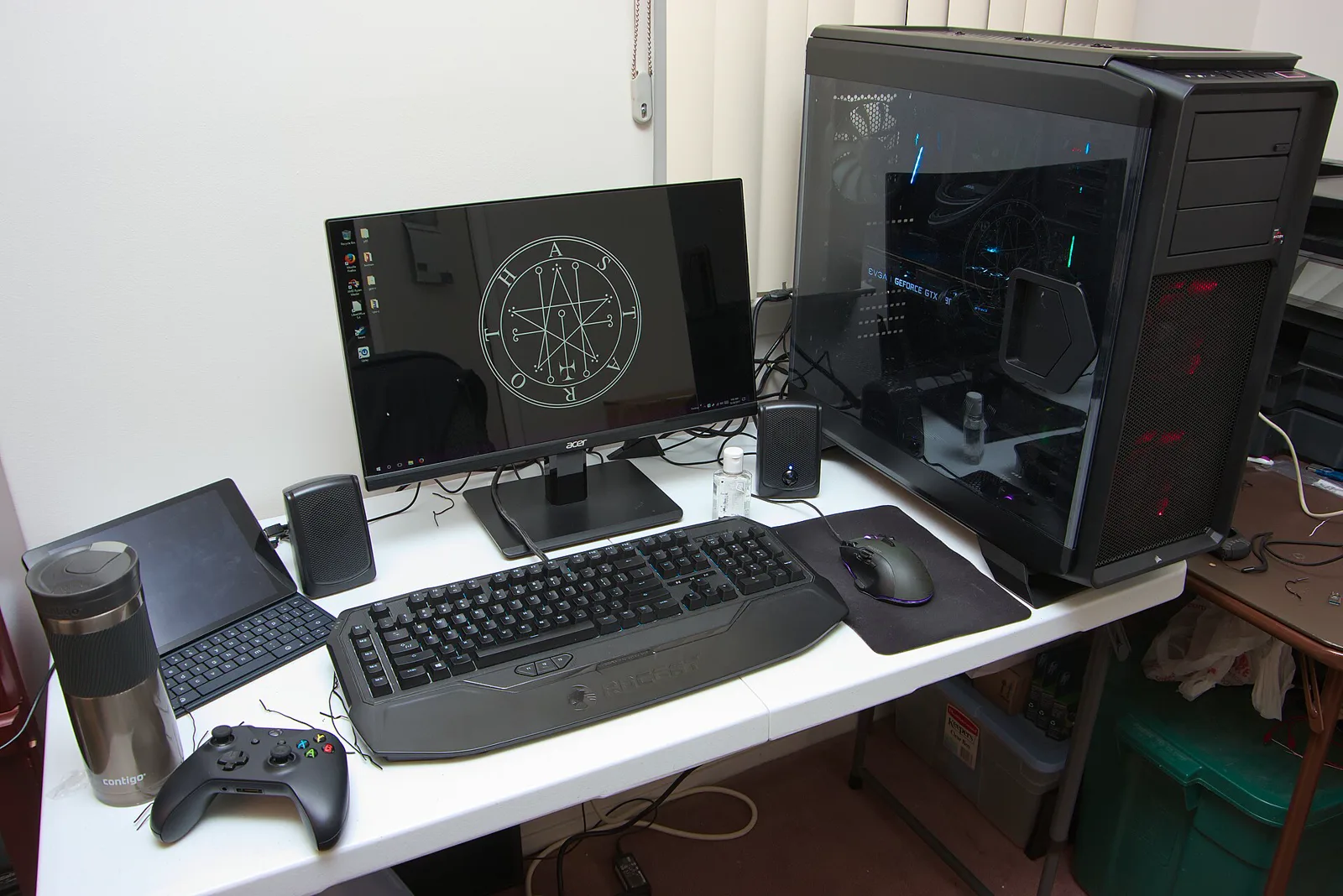 A real desktop PC gaming setup with monitor, mouse, keyboard and tower
